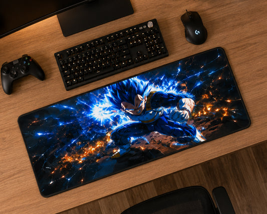 A large rectangular gaming desk mat with a colorful anime-style print of a blue-haired character surrounded by energy effects, displayed on a wooden desk alongside a keyboard, mouse, controller, and monitor.