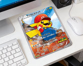 Mario Pikachu Pokémon card style mouse pad placed on modern white desk with wireless mouse and keyboard setup