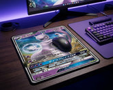 Pokémon Mewtwo GX themed gaming mouse pad with purple cosmic design beside RGB keyboard and gaming mouse