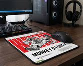 Monkey D. Luffy anime mouse pad with bold red wanted poster design on dark wooden gaming desk setup