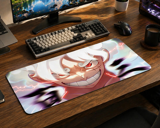 One Piece Gear 5 Luffy desk setup with extended anime mouse pad, mechanical keyboard, monitor, and modern gaming workspace.
