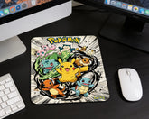 Cute Pokémon themed mouse pad with Pikachu and classic starter Pokémon placed beside wireless mouse and dual monitor setup