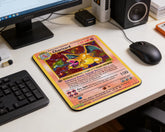 Retro Charizard Pokémon trading card style mouse pad placed on white computer desk with monitor and black wired mouse