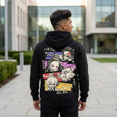Rear view of a man wearing a black Demon Slayer hoodie with a large back print featuring Tanjiro, Nezuko, Zenitsu, and Inosuke in an action-packed anime style.