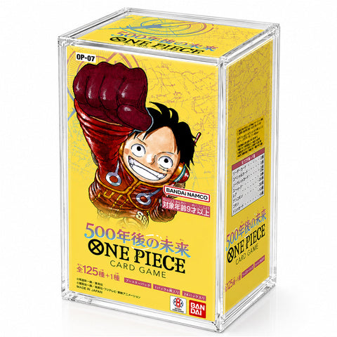 A clear acrylic display box containing a yellow One Piece card game box, featuring the character Monkey D. Luffy on the front.
