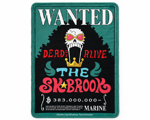 Brook One Piece gaming mouse pad featuring the Wanted Dead or Alive bounty poster, a skull with pink heart-shaped sunglasses, a golden crown, red and teal lettering, and a teal border.