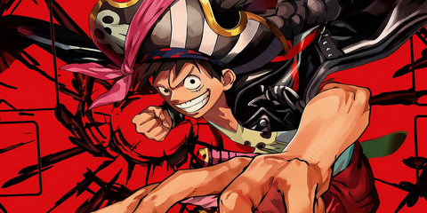Close-up of Monkey D. Luffy pirate-themed anime mouse pad with bold red background, detailed artwork, and smooth extended desk mat surface.
