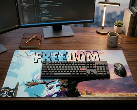 One Piece Freedom themed anime desk mat featuring Luffy and scenic sky artwork on a clean workstation desk with mechanical keyboard, monitor, and wireless mouse