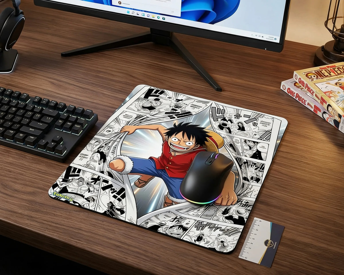 Anime gaming mouse pad featuring Monkey D. Luffy breaking through manga panels on modern wooden gaming desk