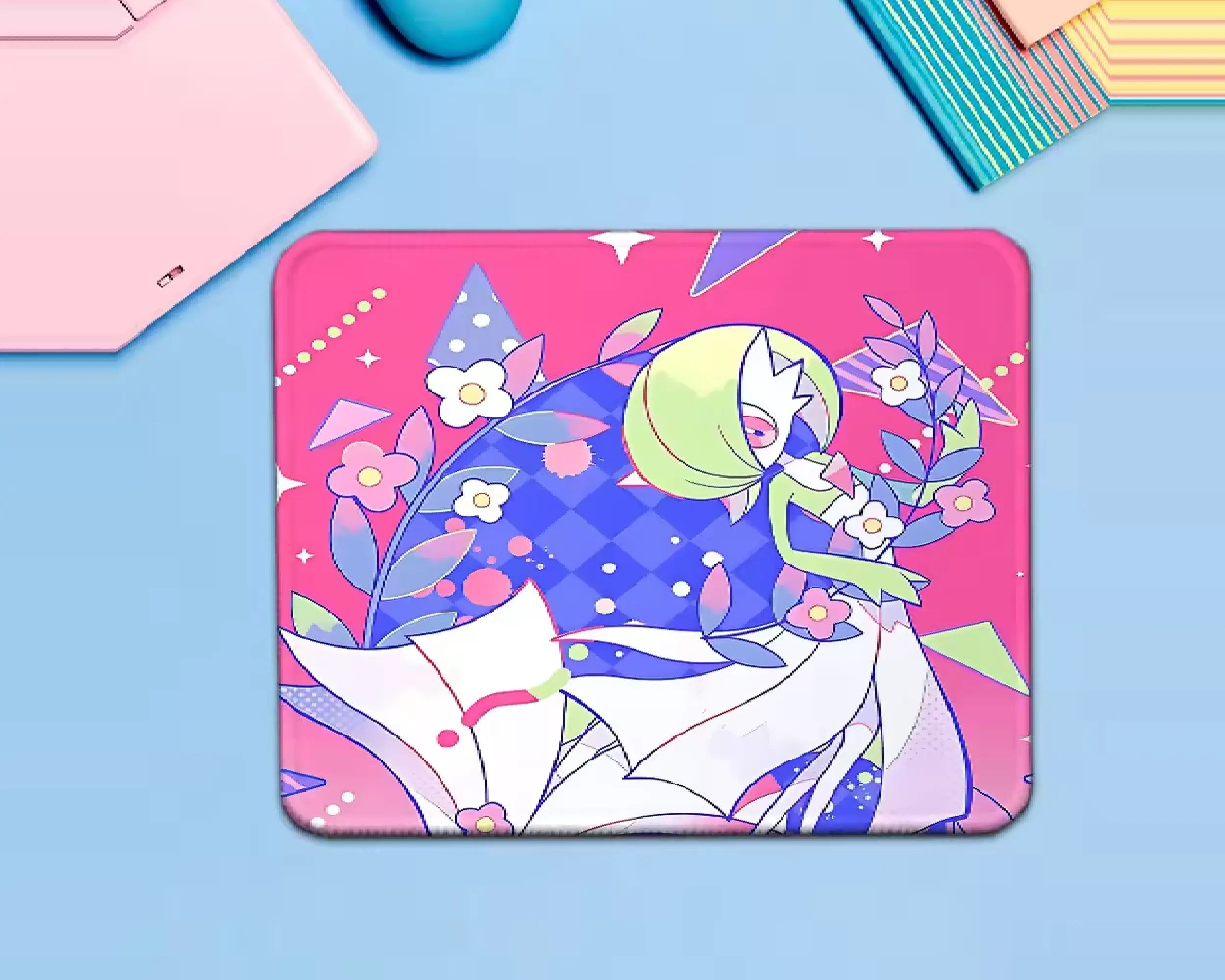 Gardevoir Pokémon mouse pad featuring elegant green-and-white character artwork surrounded by pink flowers, leafy branches, and a vibrant pink and purple background.