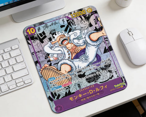 One Piece Gear 5 Luffy anime mouse pad with manga collage background placed beside keyboard and white wireless mouse