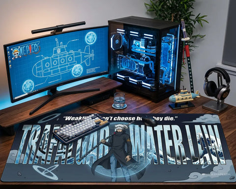 Large Trafalgar Law desk mat in gaming setup with curved monitor, RGB PC, and anime-themed accessories, showing One Piece character design.