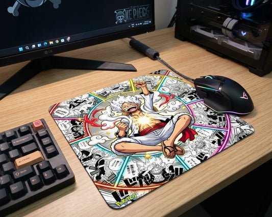 Large Gear 5 Luffy anime desk mat featuring colorful manga panel design beside RGB gaming mouse and keyboard