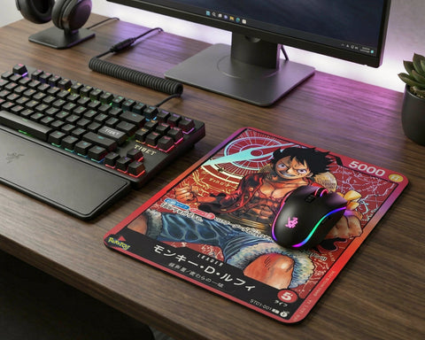 One Piece Luffy trading card style mouse pad on RGB gaming desk setup with mechanical keyboard and gaming mouse