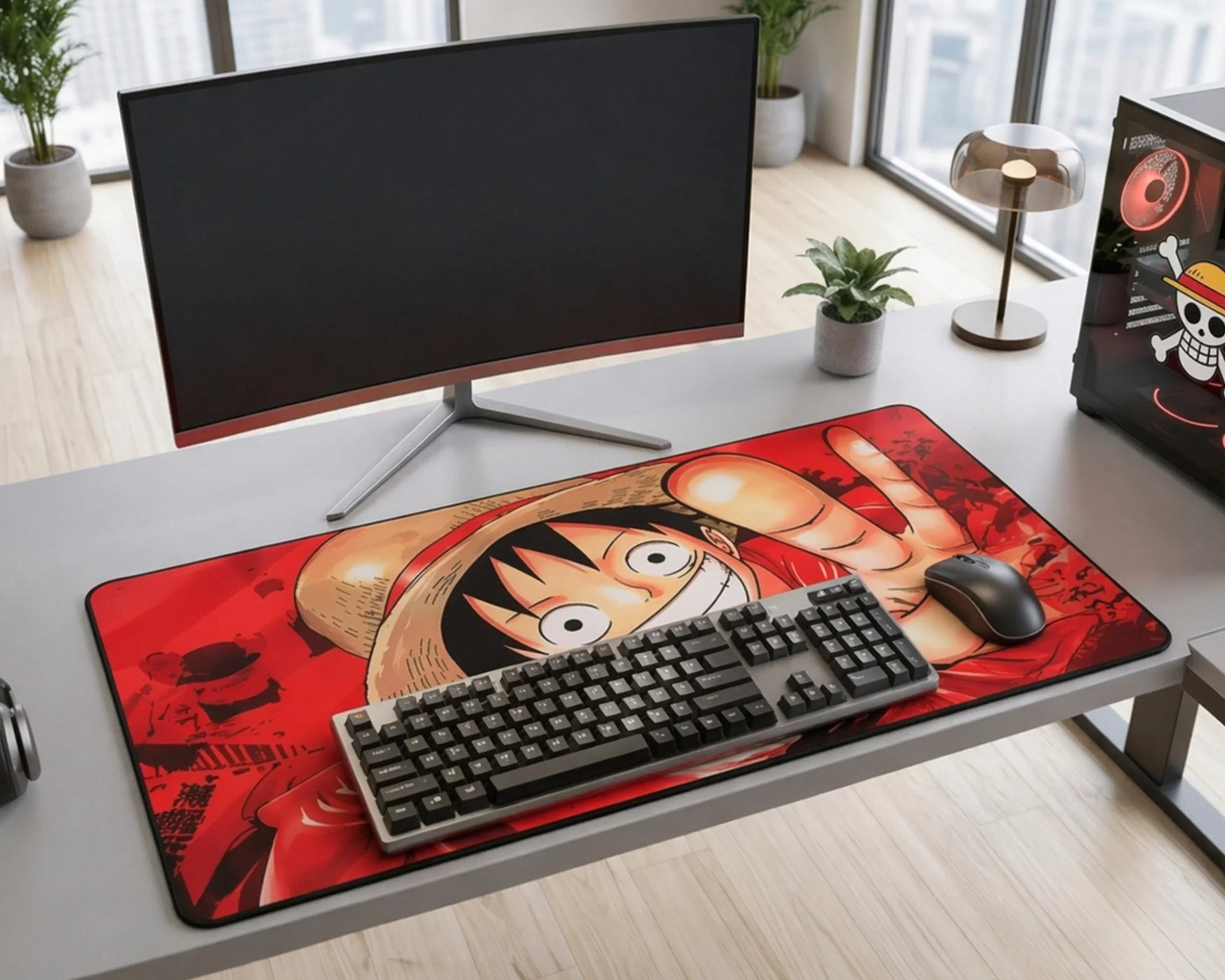 Modern desk setup with large One Piece anime mouse pad featuring Monkey D. Luffy design, keyboard, and monitor in minimalist workspace.