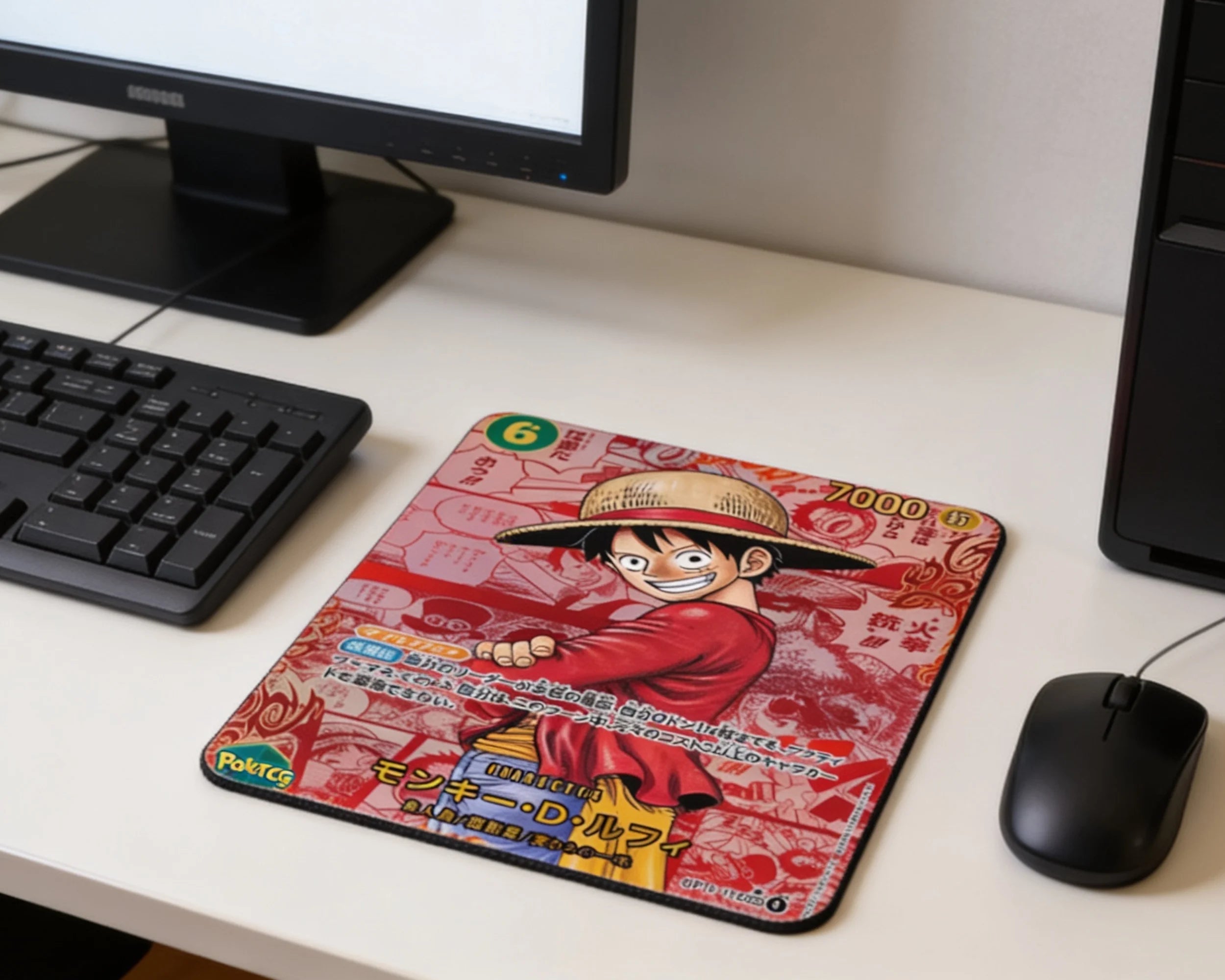 One Piece Luffy themed mouse pad with red manga artwork placed on minimalist white desktop beside wired mouse