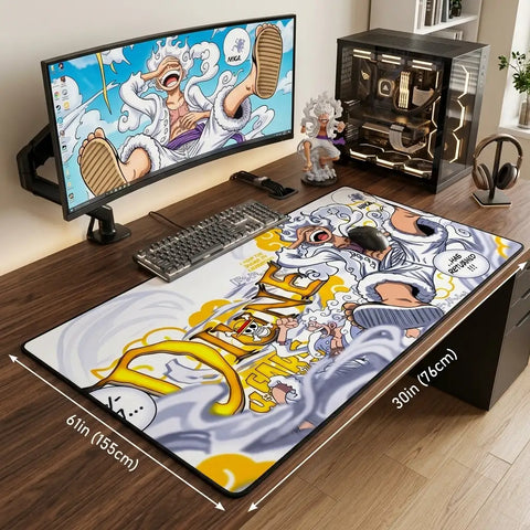 Wide gaming desk setup with oversized One Piece mouse pad (61 x 30 inches) featuring Gear 5 Luffy artwork and full keyboard coverage