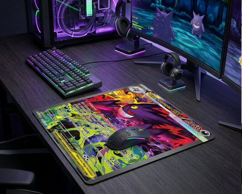 Colorful Mega Gengar EX anime gaming mouse pad placed on RGB gaming desk with mechanical keyboard and monitor