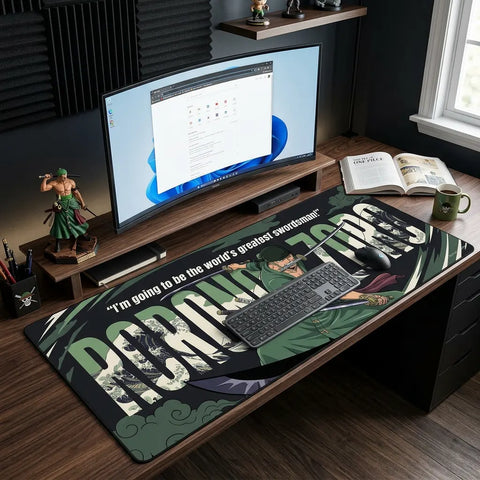 Oversized Roronoa Zoro desk mat covering entire workspace with keyboard and mouse, featuring bold anime typography and swordsman design.