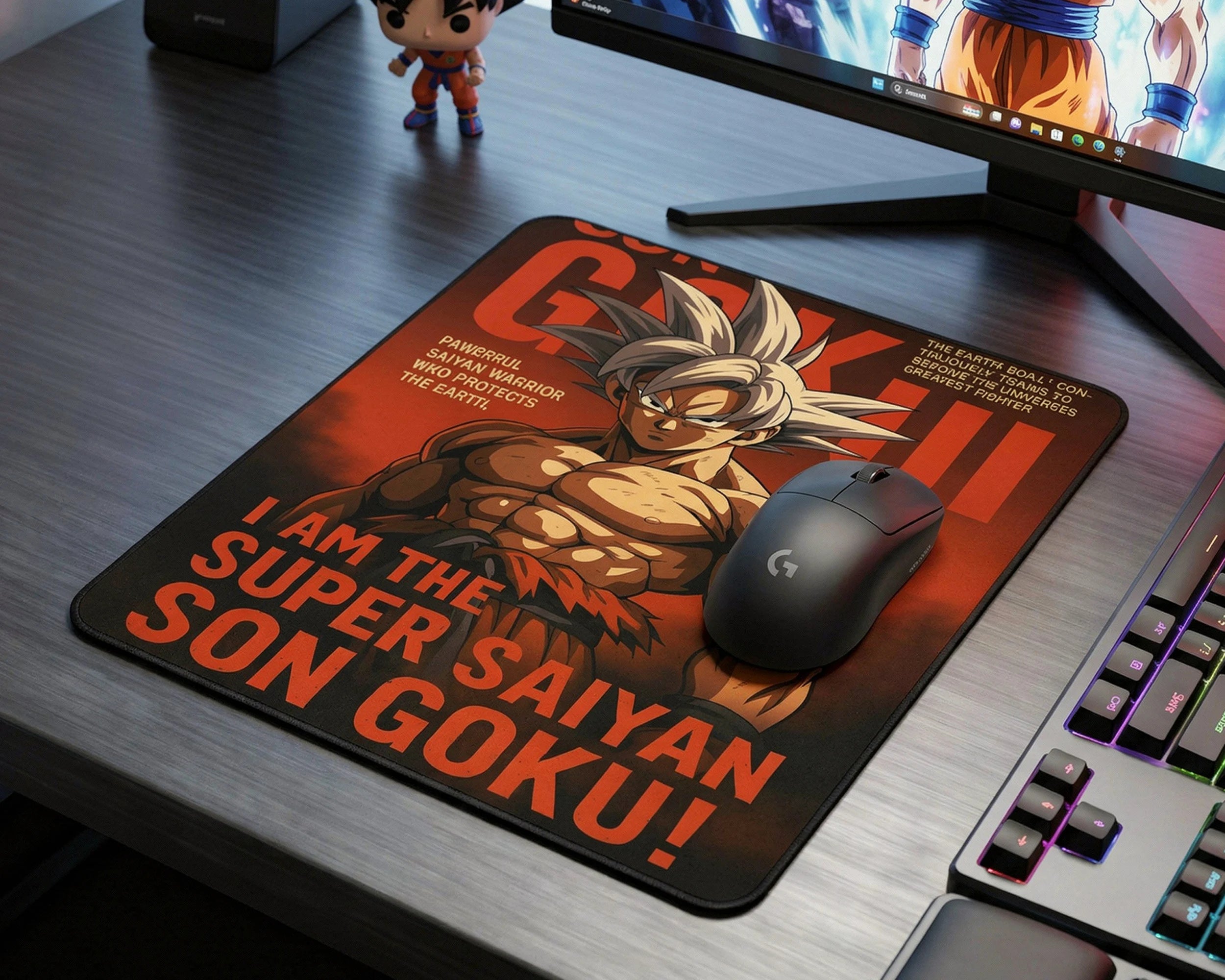 Super Saiyan Son Goku anime gaming mouse pad with bold red artwork on RGB desktop gaming setup