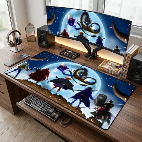 XL anime desk mat with moonlit crew design displayed on a clean modern desk setup with ultrawide monitor, speakers, keyboard, and mouse.