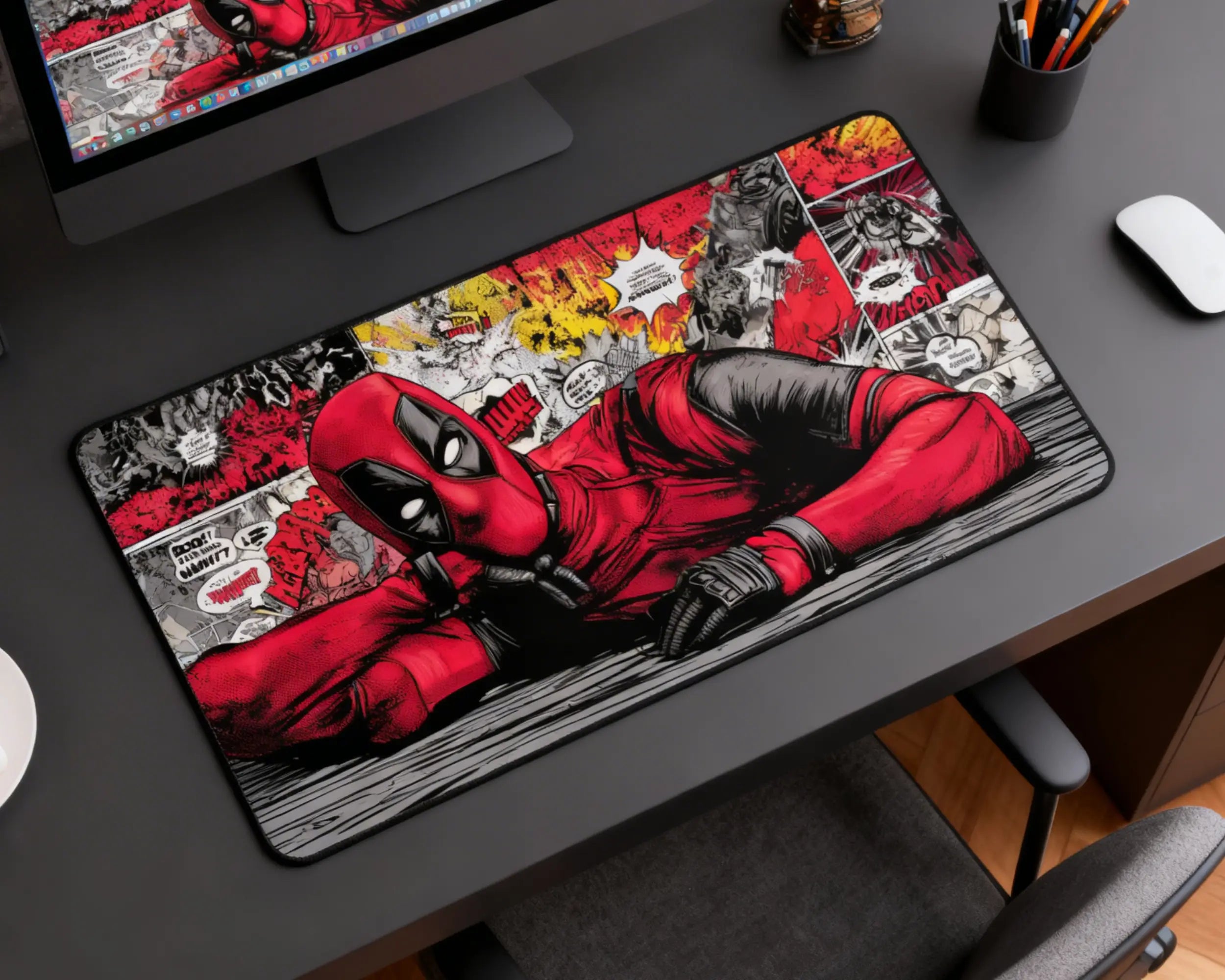 deadpool extended mouse pad with red black comic design on wooden desk setup with computer and accessories
