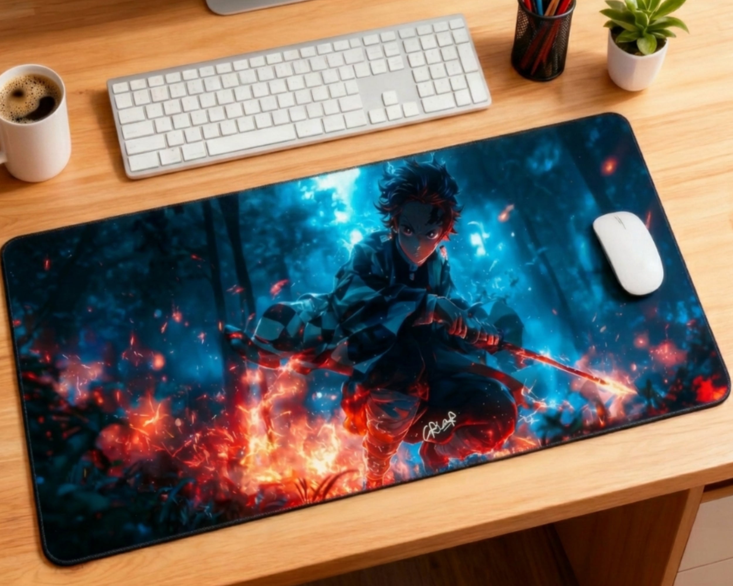 Demon Slayer Tanjiro desk mat with blue forest background and red flames, paired with white keyboard, white mouse, coffee mug, plant, and pencil holder.