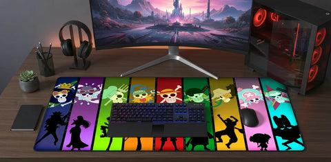 Large One Piece extended mousepad with colorful panel design, placed on a modern gaming desk with RGB keyboard, mouse, curved monitor, and PC setup.