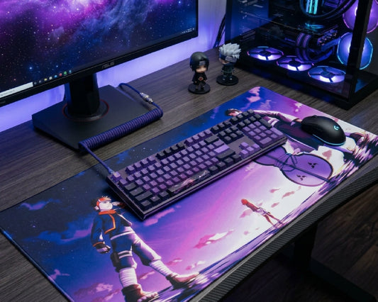 Gaming desk setup with large anime mouse pad featuring kid Obito, Rin, and Obito under a purple sky, RGB PC and keyboard