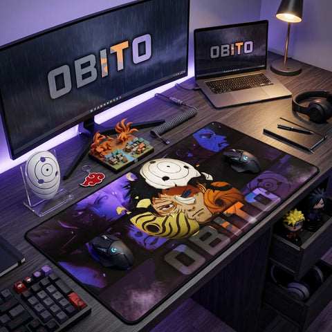 Anime-inspired workspace with ultrawide monitor, laptop, and large Obito desk mat, decorated with Naruto figures and LED lighting