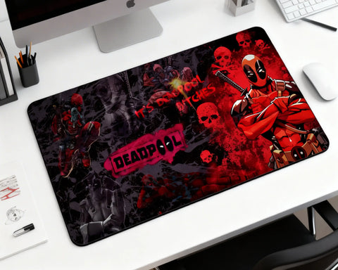 large deadpool gaming mouse pad with red black design on modern desk setup with keyboard and monitor