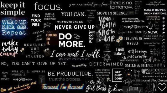 Close-up black quote collage desk mat with productivity and mindset phrases, minimalist motivational mouse pad.